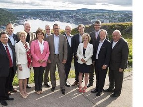 Nunavut Premier Peter Taptuna, Yukon Premier Darrell Pasloski, Ontario Premier Kathleen Wynne, Prince Edward Island Premier Wade MacLauchlan, British Columbia Premier Christy Clark, Quebec Premier Philippe Couillard, Newfoundland and Labrador Premier Paul Davis, Manitoba Premier Greg Selinger, New Brunswick Premier Brian Gallant, Alberta Premier Rachel Notley, Nova Scotia Premier Stephen McNeil, Saskatchewan Premier Brad Wall and Northwest Territories Premier Bob McLeod, left to right, pose for a group photo on Signal Hill overlooking the harbour at the summer meeting of Canada's premiers in St. John's on Thursday, July 16, 2015. THE CANADIAN PRESS/Andrew Vaughan