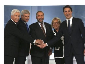Bloc Quebecois Leader Gilles Duceppe, left to right, Conservative Leader and Prime Minister Stephen Harper, New Democratic Party Leader Thomas Mulcair, Green Party Leader Elizabeth May and Liberal Leader Justin Trudeau shake hands before the start of the French-language leaders' debate in Montreal on Thursday, September 24, 2015. Canadians go to the polls in a federal election on October 19, 2015. THE CANADIAN PRESS/POOL-Christinne Muschi