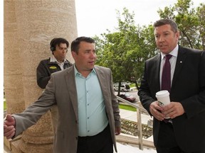 Todd Holt, left, and Sheldon Kennedy arrive to the trial of Graham James at the Court of Queen's Bench in Swift Current, Sask., on Friday, June 19, 2015. Kennedy and Holt were sexually abused by James, and have since become an advocates for other victims. THE CANADIAN PRESS/Michael Bell