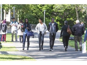 Students enjoy the sunshine in The Bowl at the University of Saskatchewan on the first day of school on Tuesday.