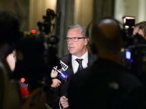 Saskatchewan Premier Brad Wall meets with reporters at the Legislative Building in Regina on Sept. 9, 2015, where he discussed the province's response to the refugee crisis.