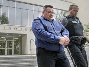 Former Whitecap Dakota First Nation accountant Hugo Gallegos was escorted from Saskatoon Court of Queen's Bench on Sept. 2, 2015, after being sentenced to five years in prison after pleading guilty to two counts each of theft over $5,000 and fraud over $5,000, a charge of laundering the proceeds of crime and a charge of possession of the proceeds of crime. (Gord Waldner / The StarPhoenix)