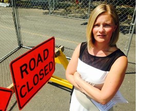Saskatoon’s director of transportation Angela Gardiner can be seen next to a road closed sign near the intersection of 20th Street West and Avenue H on Friday morning. The City is increasing efforts to record and collect information on motorists entering the restricted areas.