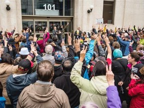 A crowd marched from City Hall to the Government of Canada building in Saskatoon in a rally in support of Syrian refugees, September 6, 2015.