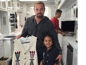 Leonardo DiCaprio and Isaiah Tootoosis hang out behind the scendes.