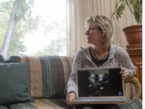 Brenda Stephens holds a computer displaying an image of her son Shane, who is struggling with a crystal meth addiction. She says she is heartbroken by the change in her son.