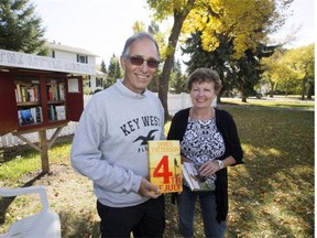 Fred and Janie Hettinga with the little free library they have created in the Montgomery neighbourhood.