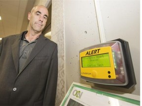 Brian Muchmore, director of U of S protective services, beside a recently installed alert beacon in the administration building on campus. The notification tool provides vital information during an emergency, as does a mobile app and computer system alert.