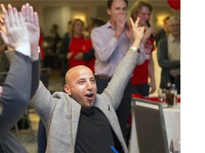 Liberal supporters like Omar Ashraf celebrate in Saskatoon with the Liberal majority government confirmed.