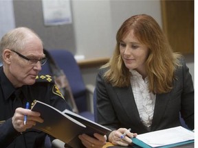 Board of Police Commissioners members Carolanne Inglis-McGray (right), alongside Saskatoon police Chief Clive Weighill