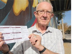 Michael Murphy, the president of the City Park Community Assocation, is concerned that the polling station for the upcoming federal election is located too far away from City Park. He poses here with his voter registration card at the entrance to City Park.