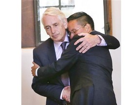 Dr. Peter Stoicheff was officially announced as the fourteenth president of the University of Saskatchewan on July 9, 2015 in Saskatoon. He and the U of S Students' Union president Jack Saddleback embrace after the announcement.