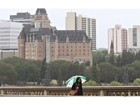 A rare bit of rain falls in Saskatoon on July 27, 2015, prompting residents to pull out their umbrellas.