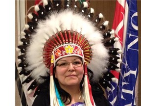 Kimberly Jonathan, the first woman to hold the top position in the Federation of Saskatchewan Indian Nations (FSIN), now wears the iconic plains Indian headdress.