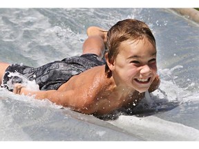 The Saskatoon Fire Department  set up a slip and slide in John Lake Park on July 21, 2015 in Saskatoon. Approximately 200 children showed up for the event.