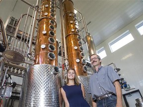 Owner John Cote and his daughter Morgan in Black Fox Spirits Distillery on Monday. The business is expected to open next week.