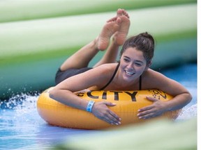 Hundreds took part in a the giant waterslide on Ravine Drive Saturday.