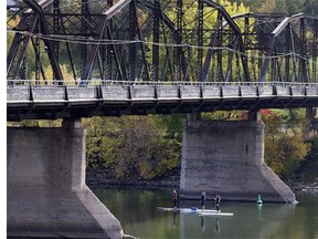 Three paddleboarders took a moment to check out the underside of Traffic Bridge as they enjoyed the sunny weather on Thursday, September 24.