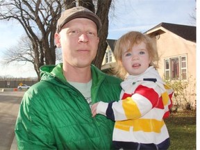 Ninth Street resident, Darren Inglis-McQuay, can be seen with daughter, Lily, who will soon be turning two in front of their home in Saskatoon's Nutana neighbourhood. Several barricades that have disconnected the street from Idylwyld Dr. can be seen in the background, and while some say the barricades are nothing but bothersome, Inglis-McQuay said they've made the street safer for everyone, including his family.