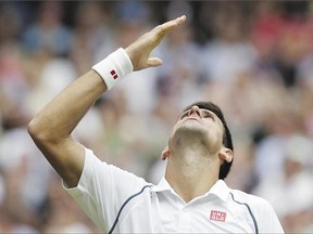 Novak Djokovic celebrates beating Roger Federer for the 2015 Wimbledon men's title Sunday. Djokovic won the match 7-6, 6-7, 6-4, 6-3.