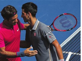 Novak Djokovic, right, congratulates Roger Federer on his win on Sunday. Federer's margin of victory was 7-6 (1), 6-3.