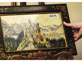 A painting of Neuschwanstein Castle, a watercolour signed A Hitler, is displayed at the Weidler auction house in Nuremberg, southern Germany. Watercolour paintings and drawings by Adolf Hitler sold at auction over the weekend for nearly US$450,000.