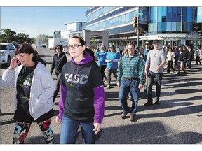 Participants in the Fetal Alcohol Spectrum Disorder Walk for Awareness make their way down 19th Street West during the 14th annual event on Wednesday.