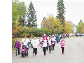 Participants take part in the Canadian Breast Cancer Foundation CIBC Walk for the Cure at Prairieland Park on Sunday.