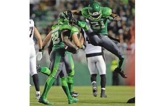 Paul Woldu, 21, who is shown celebrating a long kickoff return by Tristan Jackson, left, during Saturday's game against the Ottawa Redblacks, is delighted to be back in green and white.