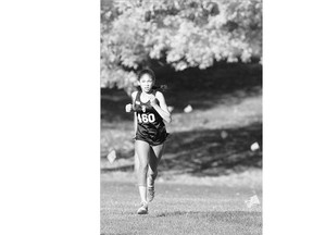 Penny Mulenga, of Saint Joseph's high school, heads to the finish line first in the midget girls race during the Ain't No Picnic high-school cross-country meet at Victoria Park on Wednesday.