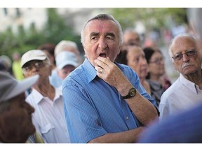 Pensioners wait for the opening of the Greece's national bank in Athens on Thursday. Those in line were allowed to withdraw a maximum of 120 euros ($170) for the week.