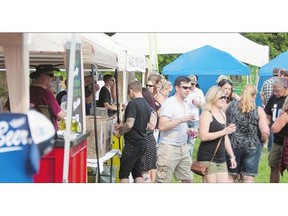 1. People get drinks at YXE Beer Fest. on Saturday at Rotary Park