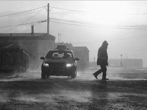 People make their way through the -46 C with wind chill temperatures in Iqaluit, Nunavut. The suicide rate among Inuit children, aged 11-14, is about 50 times the national average. Of the 45 suicides in 2013, 12 were women and 33 were men, mostly aged 15-25. These statistics prompted a special coroner's inquest that wrapped up on Sept. 25.
