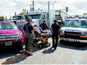 A person is taken to hospital following a collision between a semi and an SUV just north of the Miller Avenue and 51st Street intersection on Tuesday.