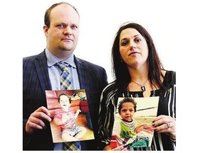 Peter Kot, left, and his wife Sylvie Fortier-Kot, with photos of their son Kayden, 4, who is being denied medical treatment in the US.