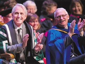 Peter Stoicheff, left, with interim provost and vice-president academic Ernie Barber, is installed as University of Saskatchewan president.