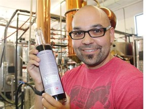 Posing with a bottle of LB Distillers’ Haskap Gin, which feature the new expanded warning labels, co-owner Michael Goldney hopes the new labels helps the public and customers make better and more informed decisions about consuming alcohol.