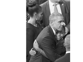 U.S. President Barack Obama embraces Eliana Pinckney, the daughter of the slain Rev. Clementa Pinckney, during his funeral in Charleston, S.C., on Friday.