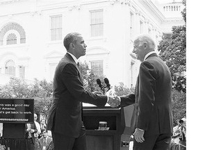 U.S. President Barack Obama shakes hands with Vice-President Joe Biden Thursday after speaking about the Supreme Court's ruling that upholds aspects of the Affordable Care Act.