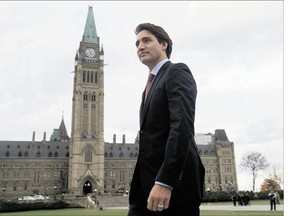 Prime minister-designate Justin Trudeau walks to a news conference from Parliament Hill in Ottawa on Tuesday.