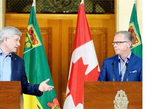 FILE: Prime Minister Stephen Harper, left, and Saskatchewan Premier Brad Wall at a news conference at the Legislative Building in Regina.