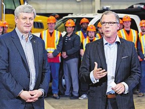 Prime Minister Stephen Harper made a visit to the Saskatchewan Department of Highways Depot in Saskatoon and took centre stage with Saskatchewan Premier Brad