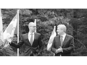 Prime Minister Stephen Harper, right, and Ukrainian Prime Minister Arseniy Yatsenyuk announce the free-trade agreement on Tuesday. While creating jobs and reducing tariffs, it is a move to help Ukraine move away from Russia's influence, said Harper.