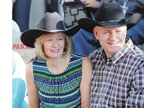 Prime Minister Stephen Harper, shown with wife Laureen, told reporters Friday that despite the recent drop in oil prices, he is confident Alberta will 'bounce back quickly.'