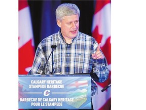 Prime Minister Stephen Harper speaks at the annual South West Stampede BBQ in Calgary on Saturday.