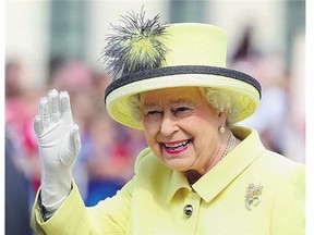Queen Elizabeth waves during a visit to Berlin on June 26.