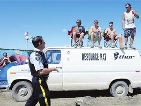 An RCMP officer talks to attendees at 2013's Craven Country Jamboree. Security has been stepped up for this year's festival.
