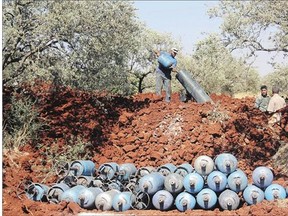 Rebel fighters fire homemade mortar rounds towards Syrian regime forces last week on the outskirts of the Syrian city of Idlib.