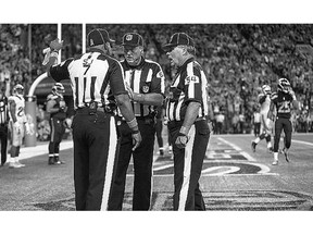 Referees confer after the ball was batted out of the end zone by Seattle linebacker K.J. Wright following a fumble by wide receiver Calvin Johnson of the Detroit Lions late in the fourth quarter of their NFL game in Seattle.