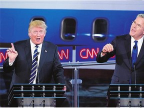 Republican presidential candidates, former Florida Gov. Jeb Bush, right, and Donald Trump both speak during the CNN Republican presidential debate on Wednesday.